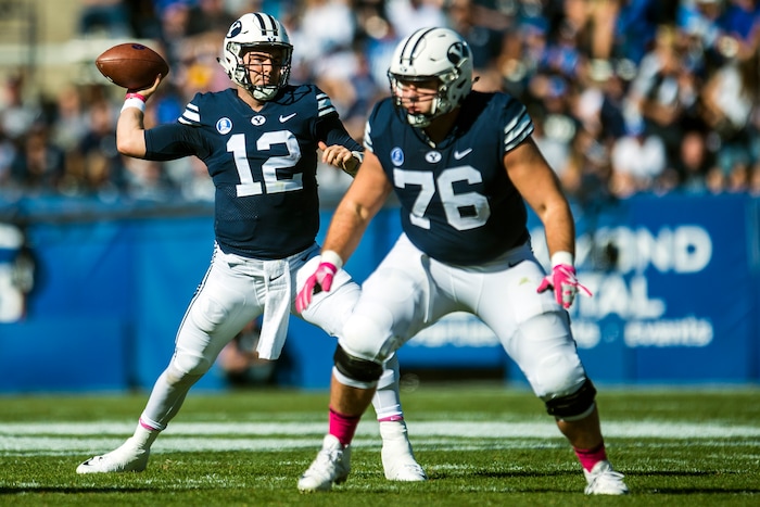 (Chris Detrick  |  The Salt Lake Tribune)  Brigham Young Cougars quarterback Tanner Mangum (12) throws the ball during the game at LaVell Edwards Stadium Saturday, October 28, 2017.  