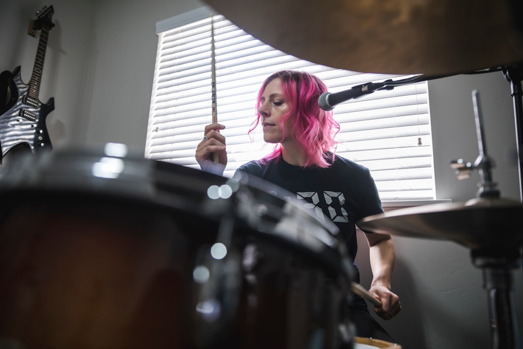 (Clark Clifford  |  For The Salt Lake Tribune) Elaine Bradley of Noble Bodies drumming during a practice for an upcoming show in the band's rehearsal space in Orem on Saturday, Aug. 3, 2019.