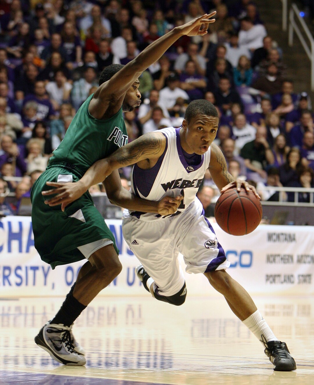 (Steve Griffin  |  Tribune file photo) In this 2010 photo, Weber State's Damian Lillard drives past Portland State's Melvin Jones during the semifinal game of the Big Sky Tournament at the Dee Events Center in Ogden.