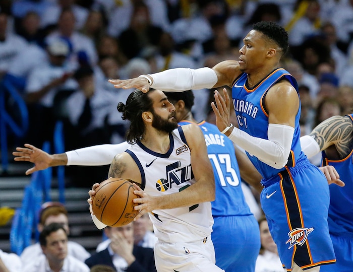Oklahoma City Thunder guard Russell Westbrook, right, defends against Utah Jazz guard Ricky Rubio during the first half of Game 5 of an NBA basketball first-round playoff series in Oklahoma City, Wednesday, April 25, 2018. (AP Photo/Sue Ogrocki)