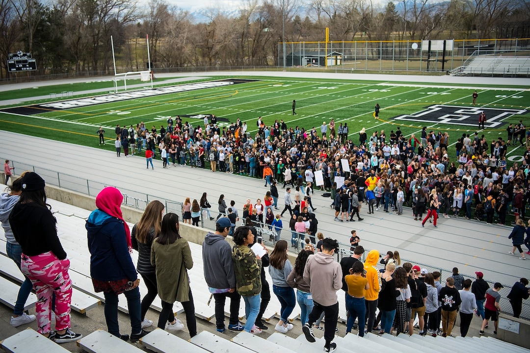 (Chris Detrick  |  The Salt Lake Tribune)  Students at Highland High School in Salt Lake City gather on the football field to participate in a nationwide demonstration for better gun safety laws Thursday, March 15, 2018. Students at more than 30 schools along the Wasatch Front, nearly all of them high schools, particiapted in the 17-minute walkout — one minute for each of the Florida students killed.