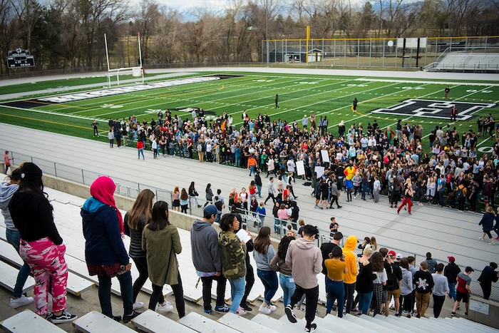 (Chris Detrick  |  The Salt Lake Tribune)  Students at Highland High School in Salt Lake City gather on the football field to participate in a nationwide demonstration for better gun safety laws Thursday, March 15, 2018. Students at more than 30 schools along the Wasatch Front, nearly all of them high schools, particiapted in the 17-minute walkout — one minute for each of the Florida students killed.