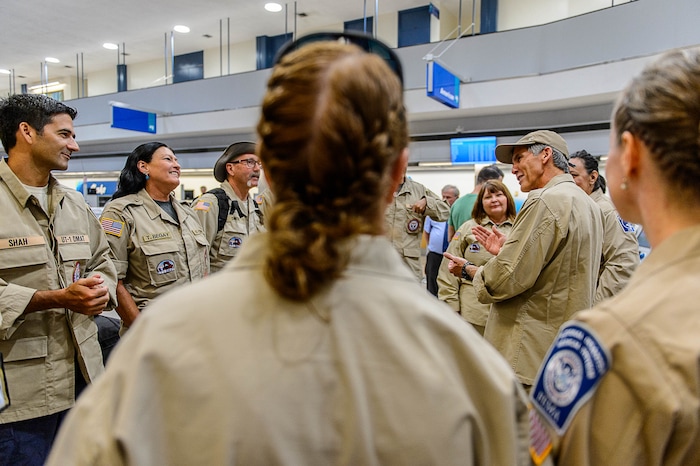 (Trent Nelson | The Salt Lake Tribune) Commander Steven Bott, right, addresses his team as members of Utah's DMAT-1 (Disaster Medical Assistance Team) meet at the Salt Lake City Airport en route to Texas, Tuesday August 29, 2017. 36 members of the team are headed to the Houston area to help with the fallout of Hurricane Harvey.