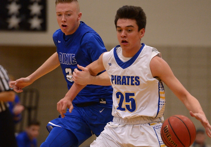 (Leah Hogsten  |  The Salt Lake Tribune) Dixie's Tanner Cuff is called for a foul while running the court with Cyprus' Tayven Aloi. Dixie High School defeated Cyprus High School boys' basketball team 59-52 during the Riverton Holiday Tournament in Riverton, December 28, 2017. 