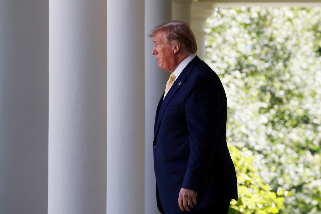 (Jacquelyn Martin | AP)  President Donald Trump walks through the Colonnade at the White House as he heads to the Rose Garden, on Friday, June 14, 2019, in Washington.