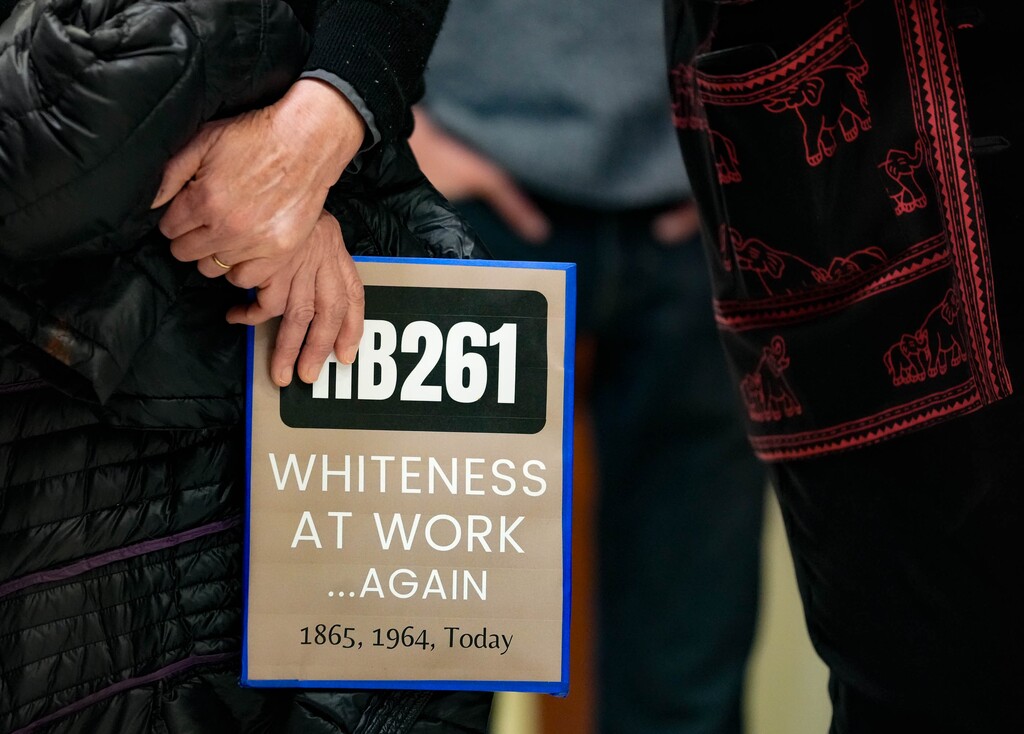 (Francisco Kjolseth  |  The Salt Lake Tribune) People hold a silent rally at the Utah Capitol before the Senate Education Committee hears HB261, the anti-DEI bill that would dismantle diversity offices in Utah public education and government, on Monday, Jan. 22, 2024.