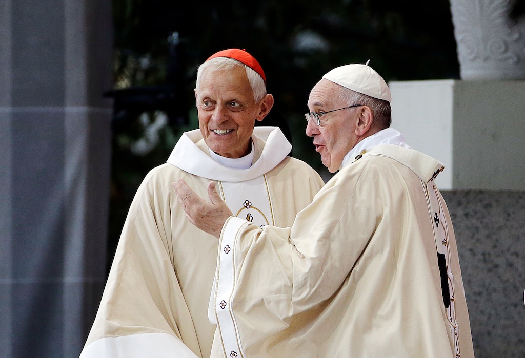 (AP Photo/David Goldman, File) In this Sept. 23, 2015, photo, Cardinal Donald Wuerl, archbishop of Washington, left, looks toward the crowd with Pope Francis after a Mass outside the Basilica of the National Shrine of the Immaculate Conception in Washington. Wuerl wrote to priests to defend himself on the eve of the scheduled Tuesday, Aug. 14, 2018, release of a grand jury report investigating child sexual abuse in six of Pennsylvania's Roman Catholic dioceses.