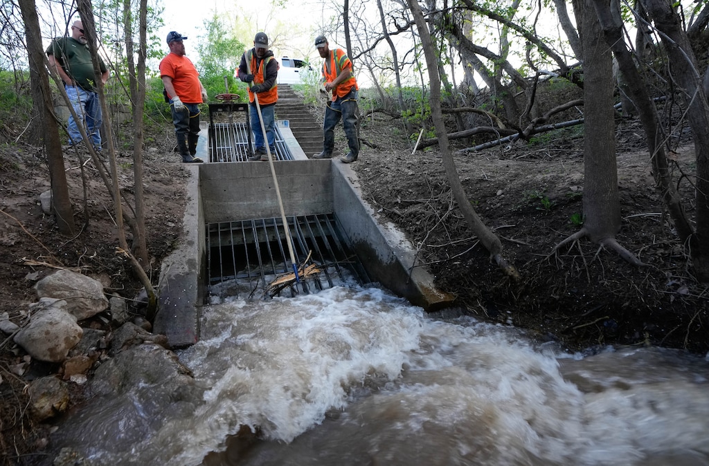 (Francisco Kjolseth | The Salt Lake Tribune) From left, Salt Lake City Public Utilities stormwater workers Scott Swanger, Brad Jeppson, Andy Gonzales and Kenny Rigby check in on Red Butte Creek near Sunnyside Park to remove debris on Wednesday, May 3, 2023. With this year’s record snowpack, resources are being devoted to around-the-clock monitoring of streams to prevent potentially damaging flooding.
