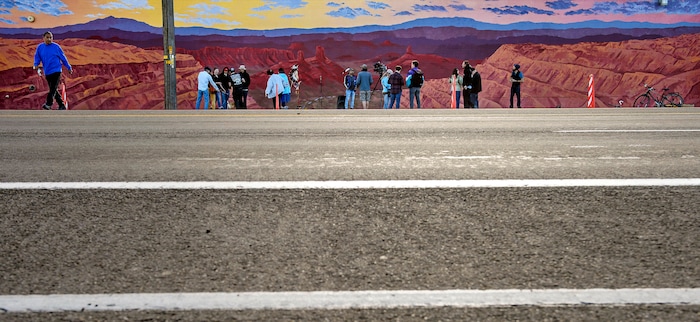 (Steve Griffin  |  The Salt Lake Tribune) Utah graphic artist Josh Scheuerman's 100’x20’ mural of the sacred lands of the Bears-Ears Inter-Tribal Coalition is officially dedicated during ceremony on 800 South near 300 West in Salt Lake City on Friday, Nov. 24, 2017.