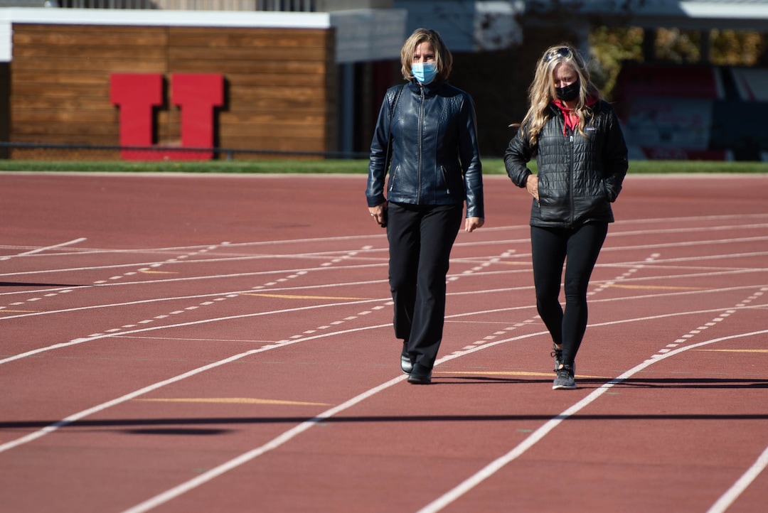 (Francisco Kjolseth  |  The Salt Lake Tribune) Jill McCluskey, left, is joined by Jenn Oxborrow, former director of the Utah Domestic Violence Coalition as they walk the track where Jill’s daughter Lauren McCluskey used to compete, during a memorial walk on the two-year anniversary of her murder on Thursday, Oct. 22, 2020.