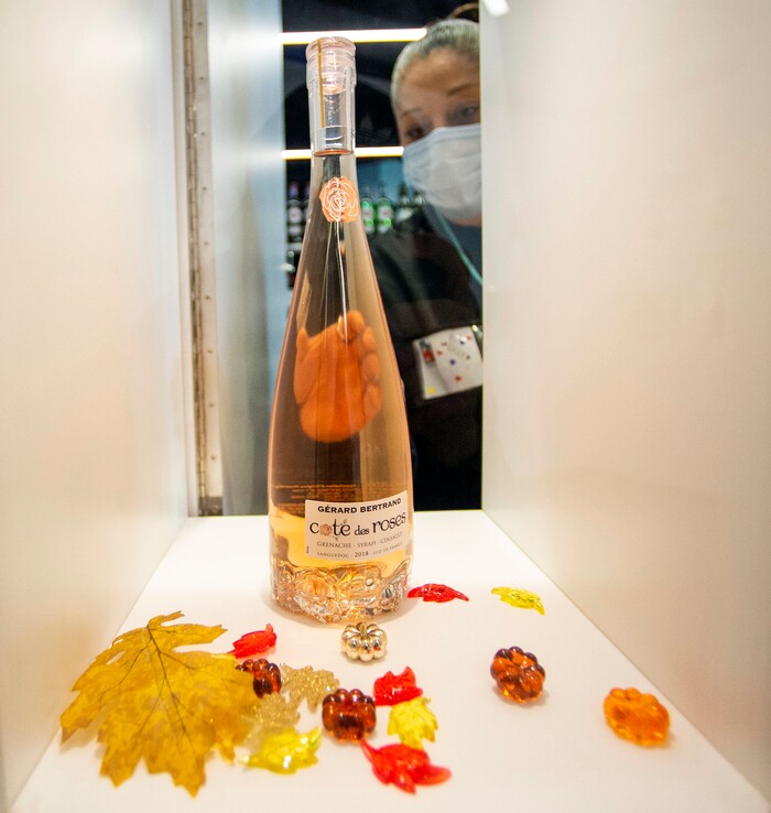 (Rick Egan | The Salt Lake Tribune)  Lilly Rodriguez arranges a bottle in the premium products room before the opening of the new state liquor and wine store in Saratoga Springs, on Monday, Nov. 16, 2020.