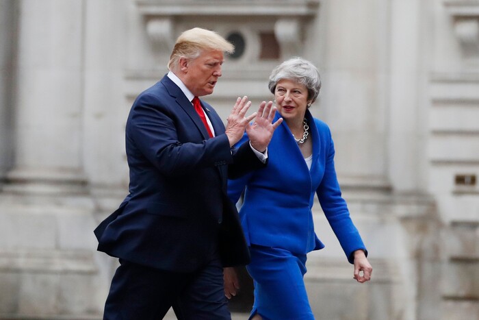 President Donald Trump walks with British Prime Minister Theresa May to a news conference at the Foreign Office, Tuesday, June 4, 2019, in central London. (AP Photo/Alex Brandon)