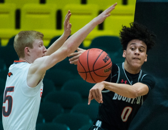 (Rick Egan  |  The Salt Lake Tribune)   Bountiful Braves Isaac Kime (0) tosses a pass as Skyridge Falcons Braden Allfrey (15) defends, in 5A basketball playoff action between the Bountiful Braves and Skyridge Falcons, at the UCCU Center in Orem, Monday, Feb. 26, 2018.