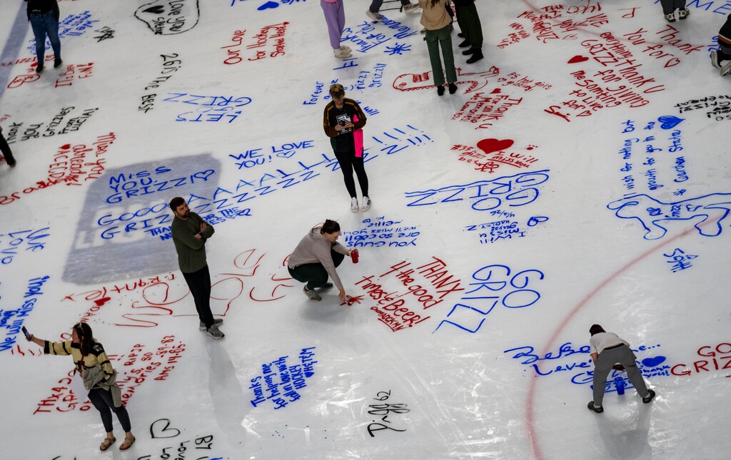 (Rick Egan | The Salt Lake Tribune) Utah Grizzlies fans write farewell messages on the ice at the Maverik Center on Sunday.
 

