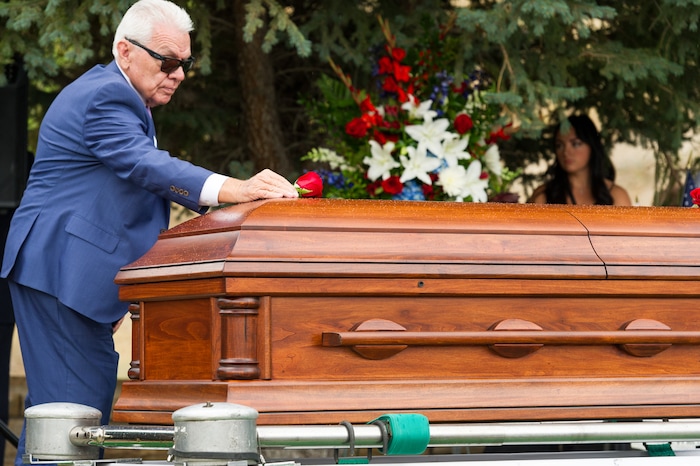 (Alex Gallivan  |  Special to The Tribune) Marine Pfc. Robert K. Holmes, who died 77 years ago aboard the USS Oklahoma during the attack on Pearl Harbor, is laid to rest in the Salt Lake City Cemetery, Monday, Aug. 20, 2018.