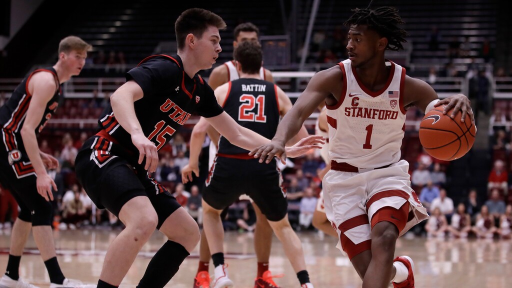 Stanford's Daejon Davis, right, drives the ball against Utah's Rylan Jones (15) in the first half of an NCAA college basketball game Wednesday, Feb. 26, 2020, in Stanford, Calif. (AP Photo/Ben Margot)