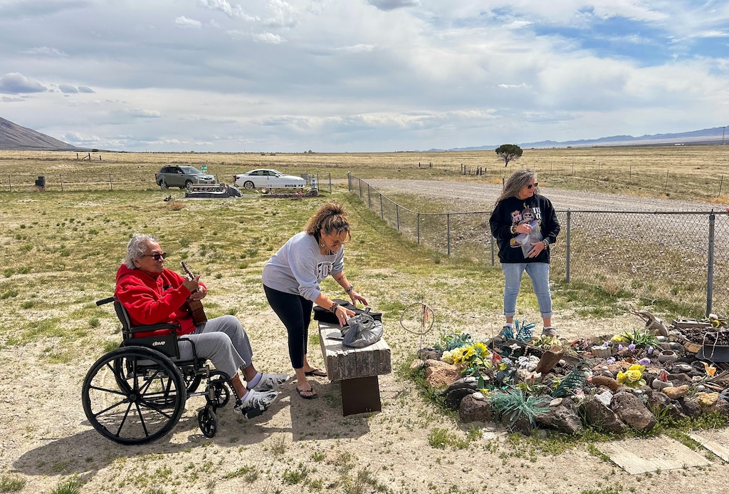 (Ruth Haws Pauni) Vermine "Tutu" Haws, wife of the late Paul Haws, plays the ukulele at his gravesite in April 2025 in Iosepa.