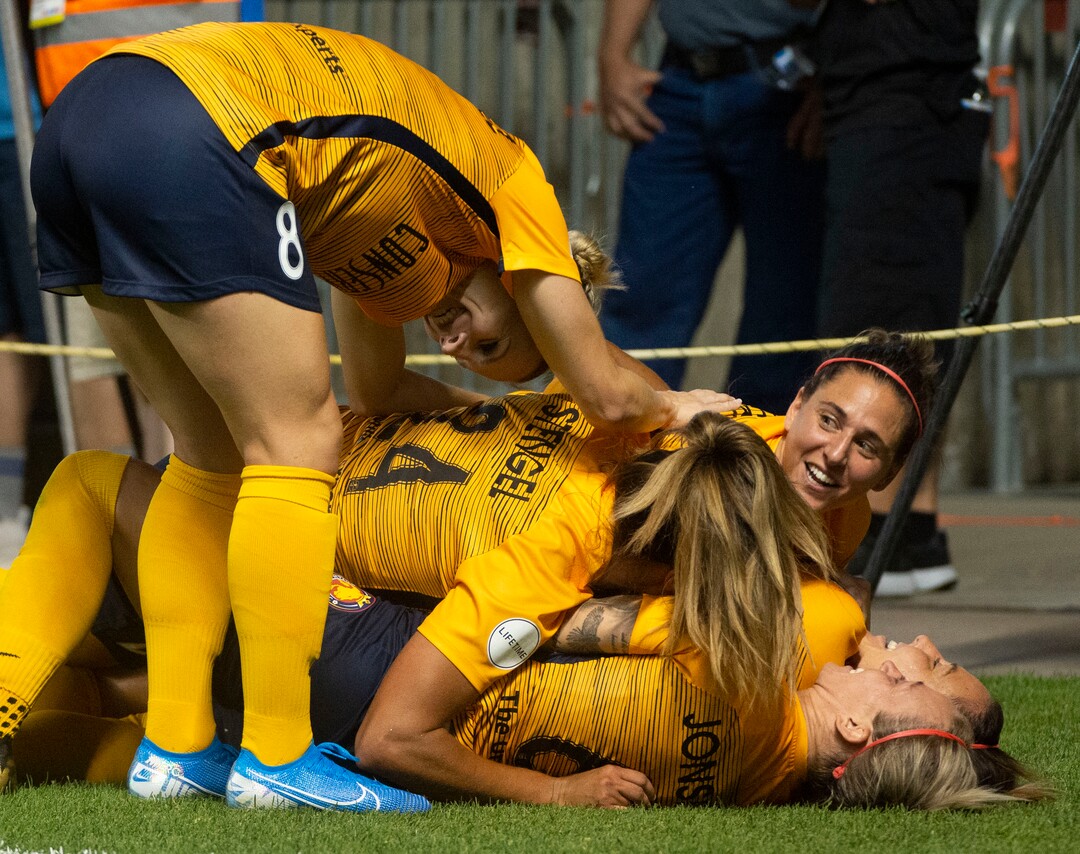 (Rick Egan  |  The Salt Lake Tribune)     Utah Royals celebrate Rachel Corsie (2) game tying goal, in Soccer action between Utah Royals FC and Portland Thorns FC, in Sandy, Friday, July 19, 2019.