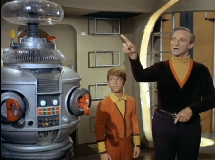 (Photo courtesy of CBS) The Robot, Will Robinson (Billy Mumy) and Dr. Smith (Jonathan Harris) in the original “Lost in Space.”