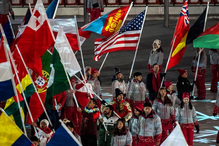 (Chris Detrick | The Salt Lake Tribune) Cross country skier Jessie Diggins carries the American flag during the PyeongChang 2018 Olympic Winter Games Closing Ceremony at Olympic Stadium Sunday, Feb. 25, 2018.