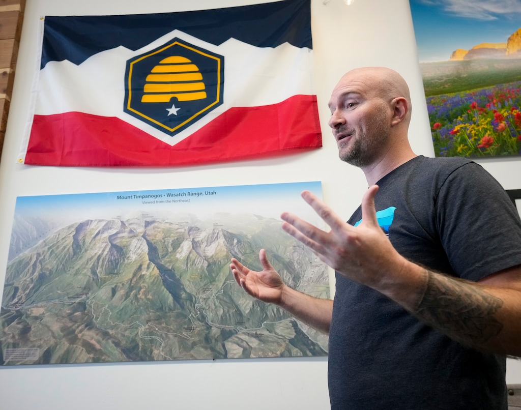 (Bethany Baker | The Salt Lake Tribune) Joseph Vogel, the founder of the hiking store Timpanogos Hiking Co., speaks about his journey as a business owner as he approaches the one year anniversary for Timpanogos Hiking Co. in Provo on Wednesday, May 8, 2024. Following up on the success of the badges the store offered last year for those who summited Mount Timpanogos, it is offering a Ten Peak Challenge. Badges are available for hikers of 10 of Northern Utah's most recognizable peaks as well as the Y above BYU.