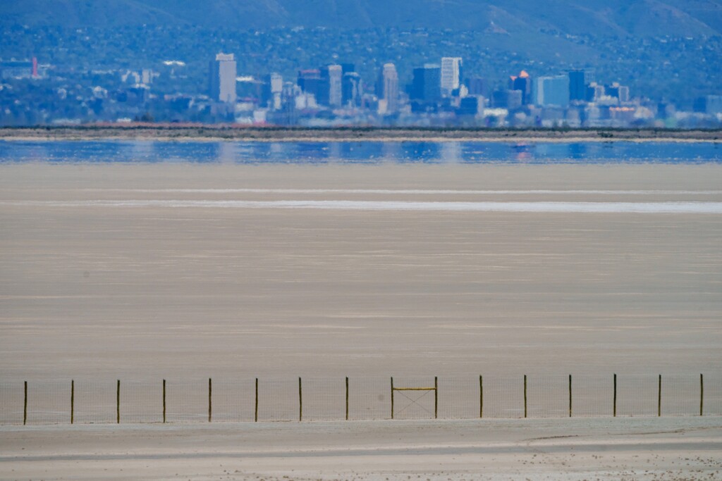 (Trent Nelson  |  The Salt Lake Tribune) The shore of the Great Salt Lake, with Salt Lake City in the distance, as seen from Antelope Island on Thursday, May 1, 2025.