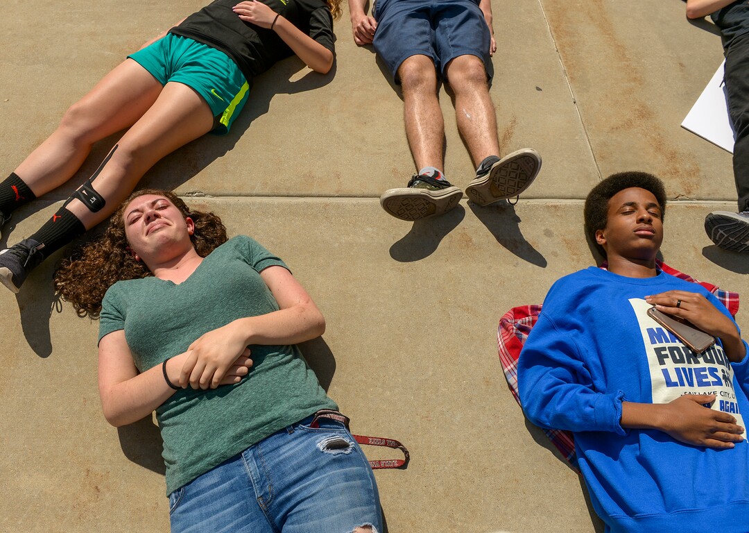 (Leah Hogsten  |  The Salt Lake Tribune)  l-r Copper Hills  High School student Haley Brewster cries during the 22-minute die-in while next to classmate Daud Mumin.  Members of March For Our Lives SLC members and concerned citizens gather at the Utah Capitol, Friday, May 18, 2018, to demand gun reform and honor the 10 dead who were killed during Friday morning's shooting spree inside Santa Fe High School in southeast Texas.