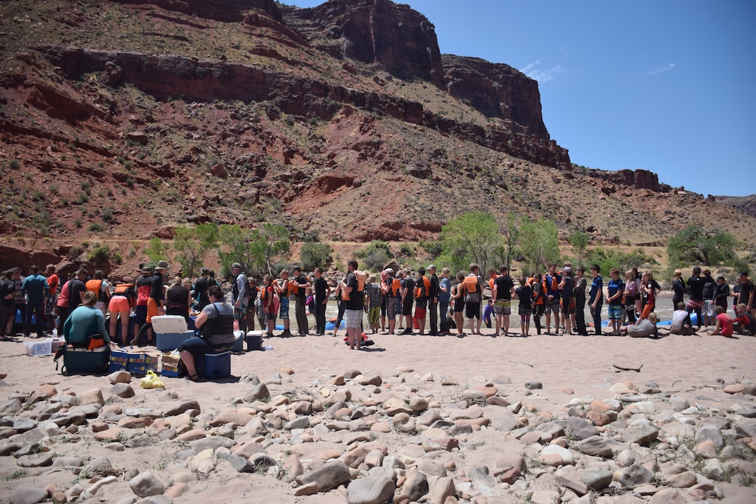 (Shannon Mullane for High Country News) More than one hundred Rock Rally rafters line up for a picnic lunch on July 27, 2019.