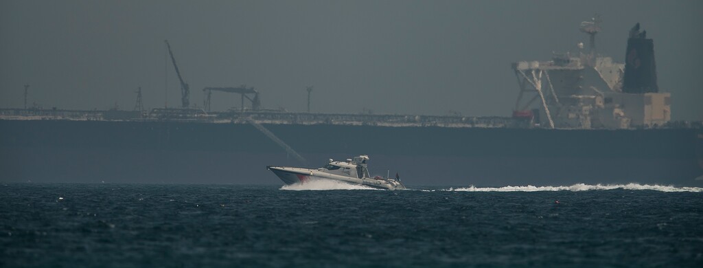 (Jon Gambrell | The Associated Press) An Emirati coast guard vessel passes an oil tanker off the coast of Fujairah, United Arab Emirates, Monday, May 13, 2019. Saudi Arabia said Monday two of its oil tankers were sabotaged off the coast of the United Arab Emirates near Fujairah in attacks that caused "significant damage" to the vessels, one of them as it was en route to pick up Saudi oil to take to the United States.