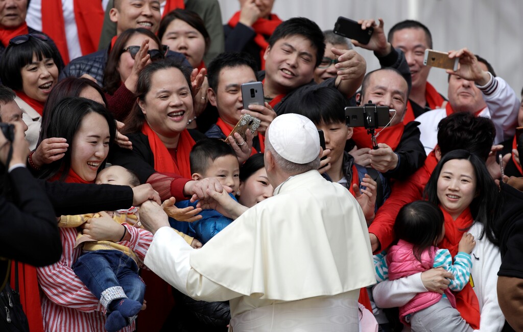 (AP Photo/Gregorio Borgia) Pope Francis meets a group of faithful from China at the end of his weekly general audience in St. Peter's Square, at the Vatican, Wednesday, April 18, 2018.