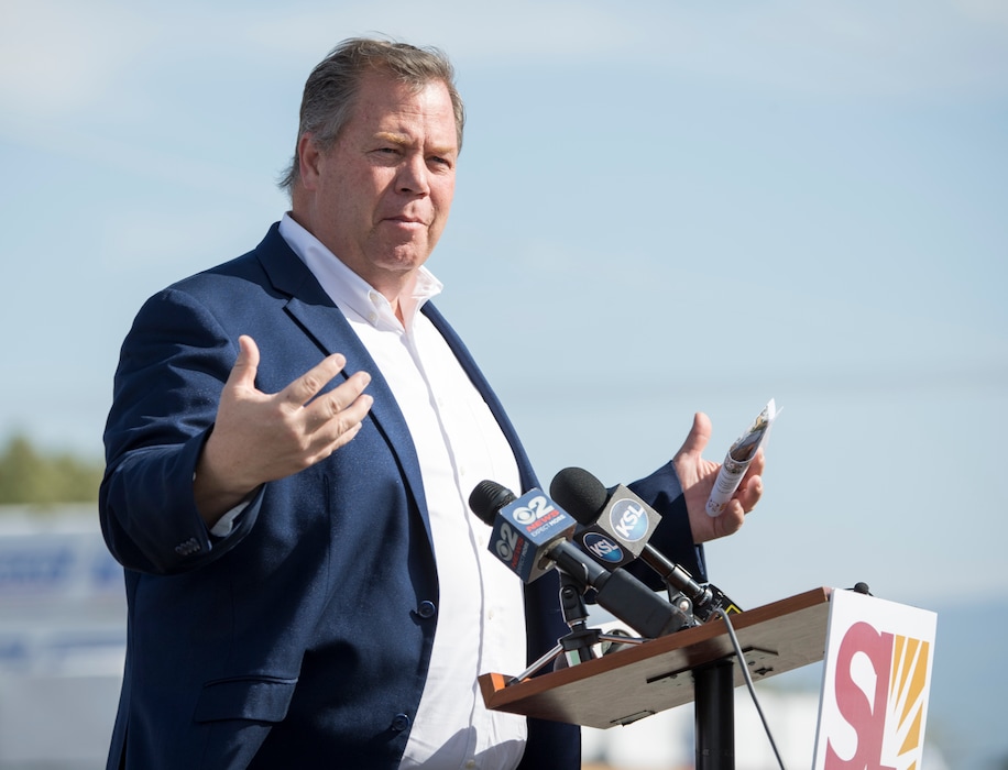 (Rick Egan  |  The Salt Lake Tribune)    Rep. Eric Hutchings speaks at a news conference in the warehouse area of the old Camp Kearns Army Air Force Base, as Salt Lake County celebrates the completion of a $1.9 million project to pave roads and increase business opportunities in the area. Thursday, Aug. 30, 2018.