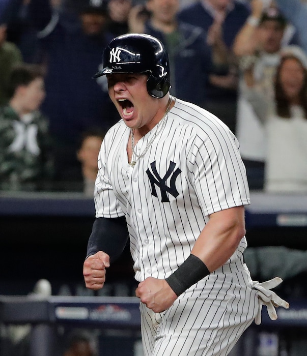 New York Yankees' Luke Voit reacts after scoring on a sacrifice fly by Didi Gregorius against the Oakland Athletics during the sixth inning of the American League wild-card playoff baseball game, Wednesday, Oct. 3, 2018, in New York. (AP Photo/Frank Franklin II)