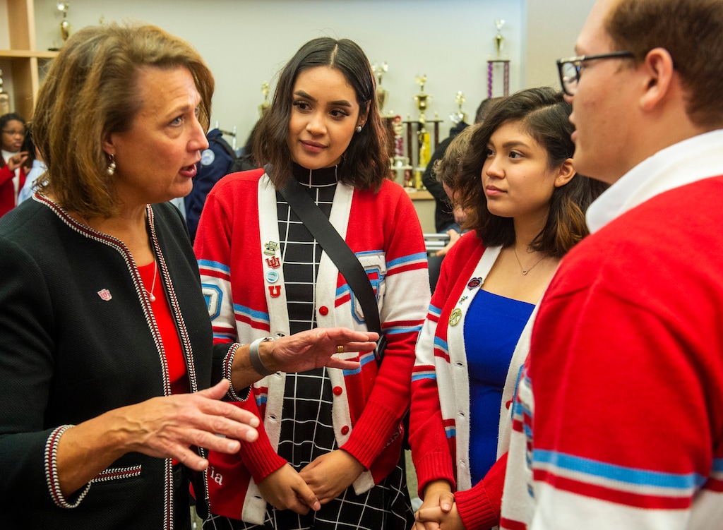 (Rick Egan | The Salt Lake Tribune) University of Utah President Ruth Watkins visits with Granger High students, Maria Tores, Valeria Lopez and Ian Coronado, as The University of Utah announces a new scholarship and tuition program during a news conference at Granger High School, Thursday, Nov. 7, 2019. Watkins announced Tuesday, Jan 12, 2021 that she is stepping down and has accepted a post to lead Strada Impact, a national education program focused on getting students to complete college.
