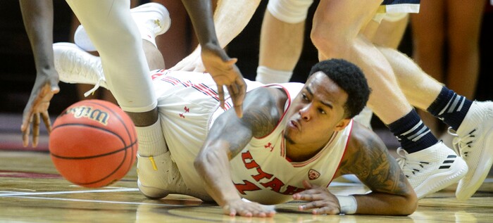 (Steve Griffin  |  The Salt Lake Tribune)  Utah Utes guard Justin Bibbins (1) falls to the court during the Utah versus UC Davis men's NIT basketball game at the Huntsman Center in Salt Lake City Wednesday March 14, 2018.