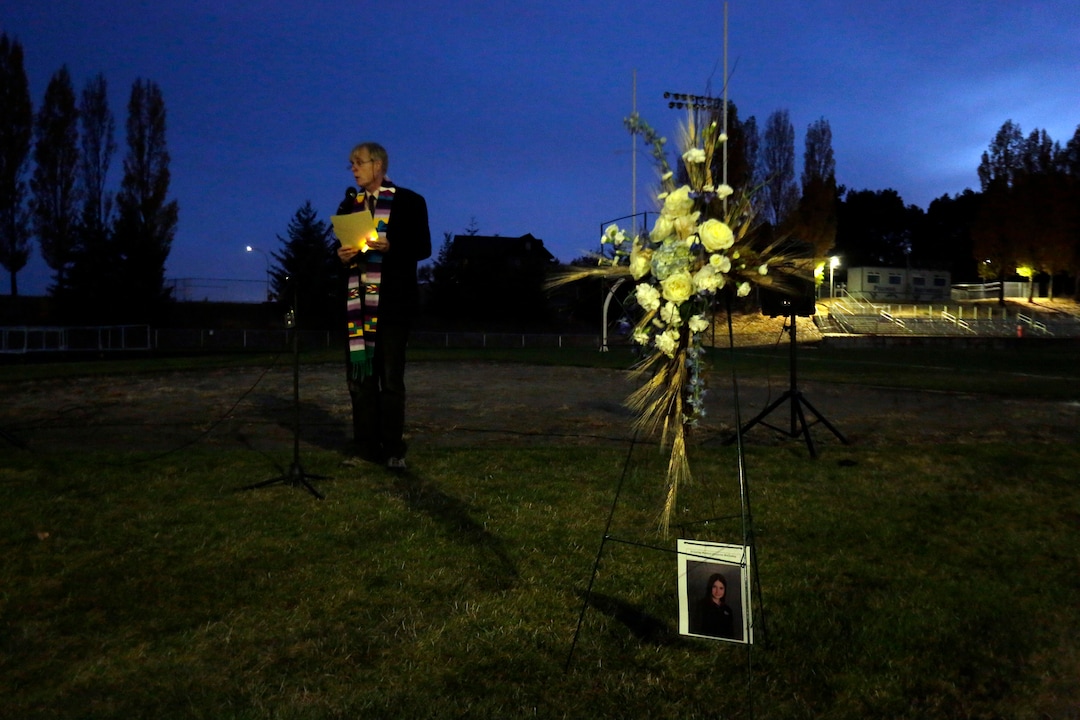 (Kai Eiselein  |  The Moscow-Pullman Daily News via AP) Minister Steve Van Kuiken speaks during a vigil for slain Pullman High School graduate and University of Utah track athlete and communications major Lauren McCluskey Wednesday, Oct. 24, 2018, in Pullman, Wash. Police said Melvin Rowland, 37, fatally shot 21-year-old McCluskey of Pullman, on Monday night on the university campus and then killed himself in a church as officers closed in.