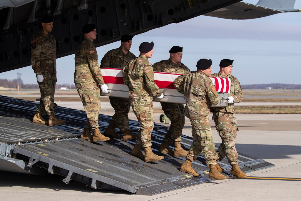 (Alex Brandon | AP file photo) An Army carry team moves a transfer case containing the remains of U.S. Army Sgt. 1st Class Michael Goble, at Dover Air Force Base, Del., on Dec. 25, 2019. Goble, a U.S. Special Forces soldier who died in Afghanistan, was seizing a Taliban weapons cache when he was killed, the U.S. military said.