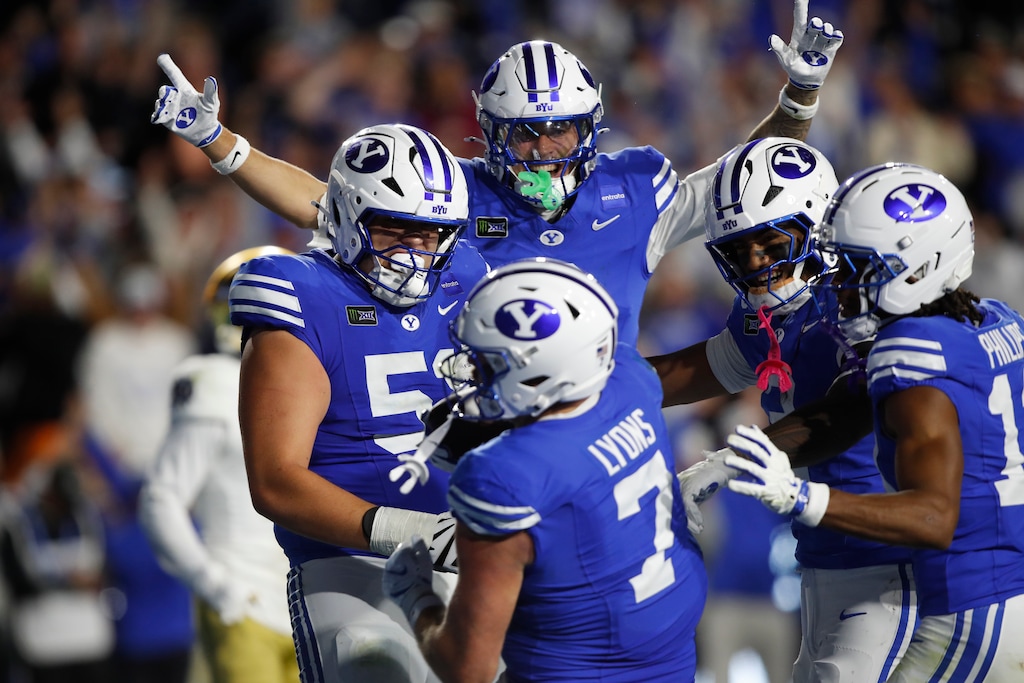 (George Frey | Special to The Tribune) BYU Cougars tight end Walker Lyons (7) celebrates his game-winning touchdown with his teammates during a game against Notre Dame Fighting Irish at LaVell Edwards Stadium on October 17, 2026.