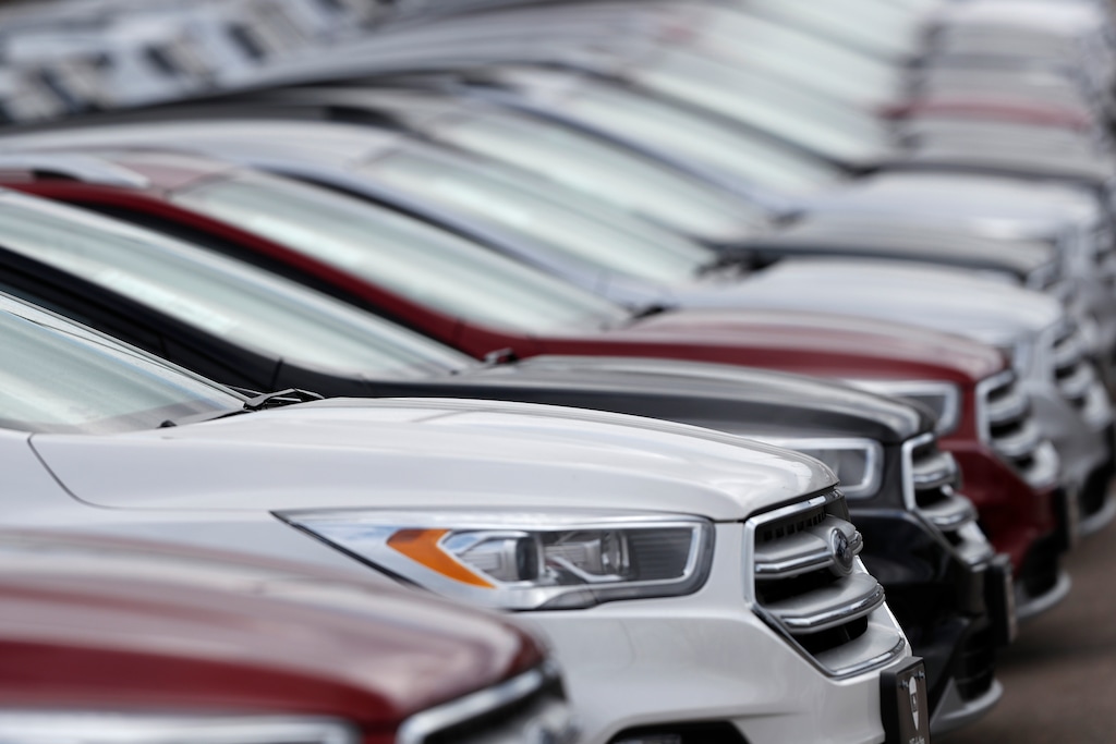 (David Zalubowski | The Associated Press) In this Sunday, Feb. 17, 2019, file photo, unsold 2019 Escape sports-utility vehicles sit in a long row at a Ford dealership in Broomfield, Colo. 