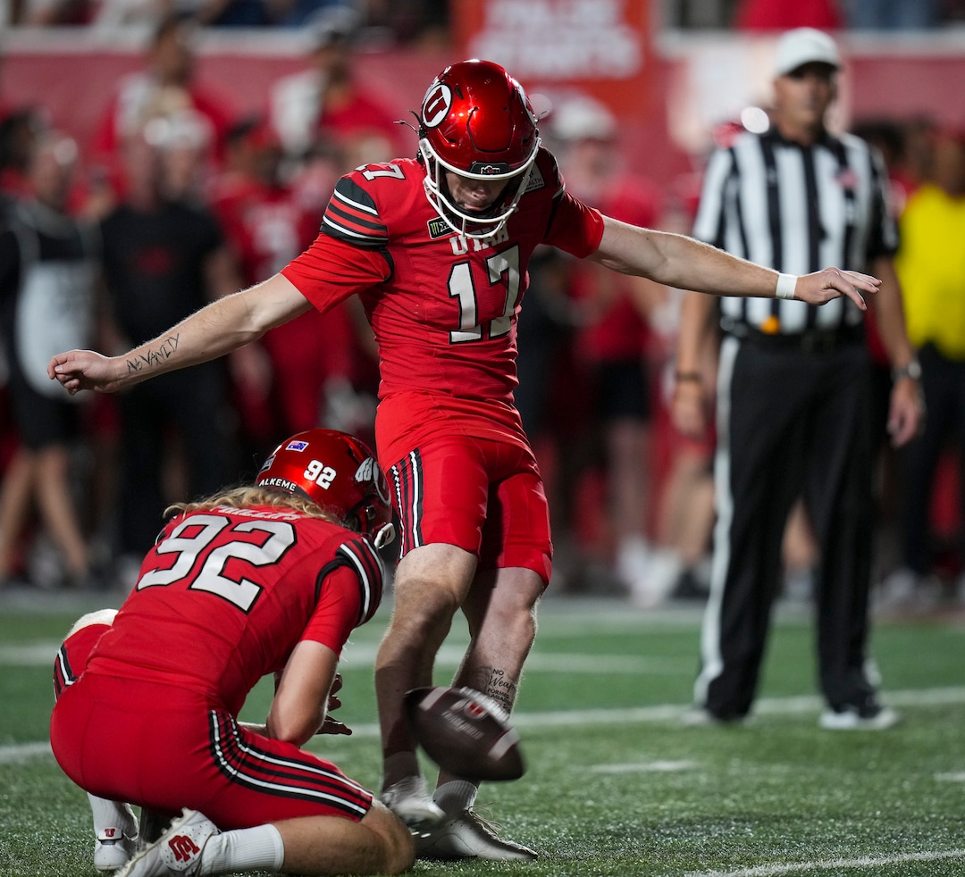 (Bethany Baker  |  The Salt Lake Tribune) Utah Utes kicker Dillon Curtis (17) kicks a field goal assisted by Utah Utes punter Orion Phillips (92) during the second half of the game between the Utah Utes and the Idaho Vandals at Rice-Eccles Stadium in Salt Lake City on Thursday, Sept. 3, 2026.