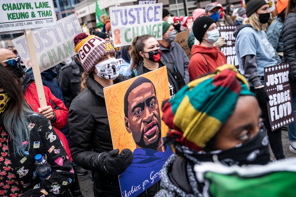 (John Minchillo | The Associated Press) Demonstrators gather during a rally outside the Hennepin County Government Center before the murder trial against former Minneapolis police Officer Derek Chauvin in the killing of George Floyd advances to jury deliberations, Monday, April 19, 2021, in Minneapolis.