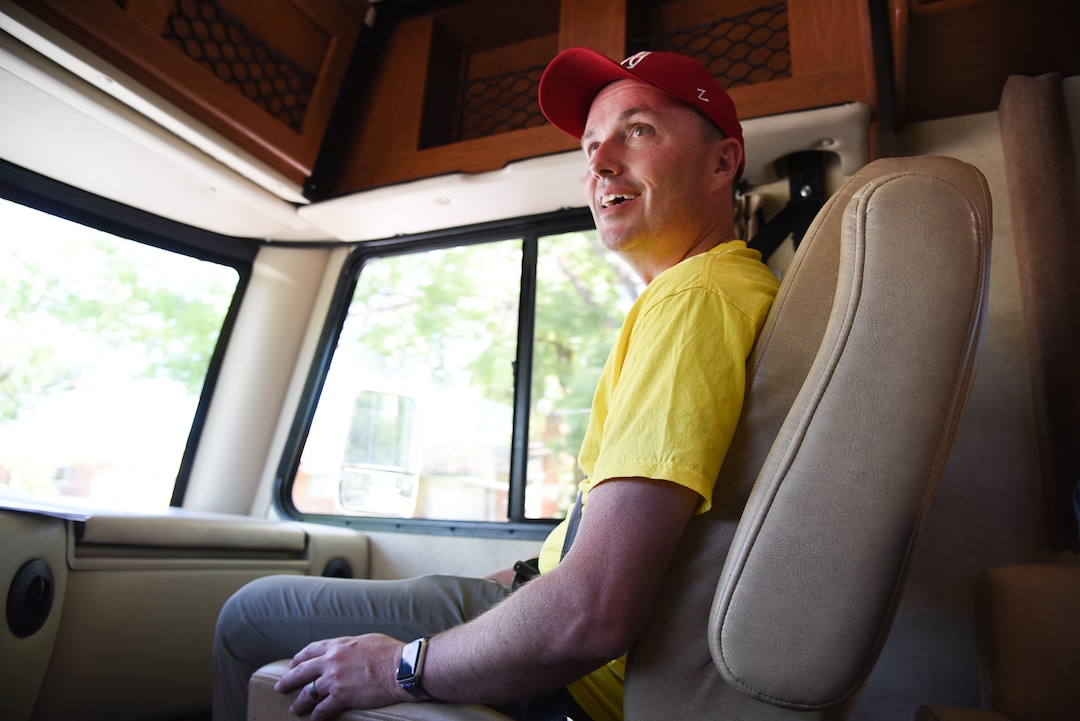 (Francisco Kjolseth  |  The Salt Lake Tribune)  Lt. Gov. Spencer Cox sits in the passenger seat of his dad's RV, which he had wrapped in John Deere colors for his campaign tour of the state as he attempts to visit each of the 248 cities and towns in Utah during his gubernatorial campaign. With nearly 80 towns so far the Lt. Gov. was wrapping up his tour of Box Elder County on Tuesday, July 30, 2019.