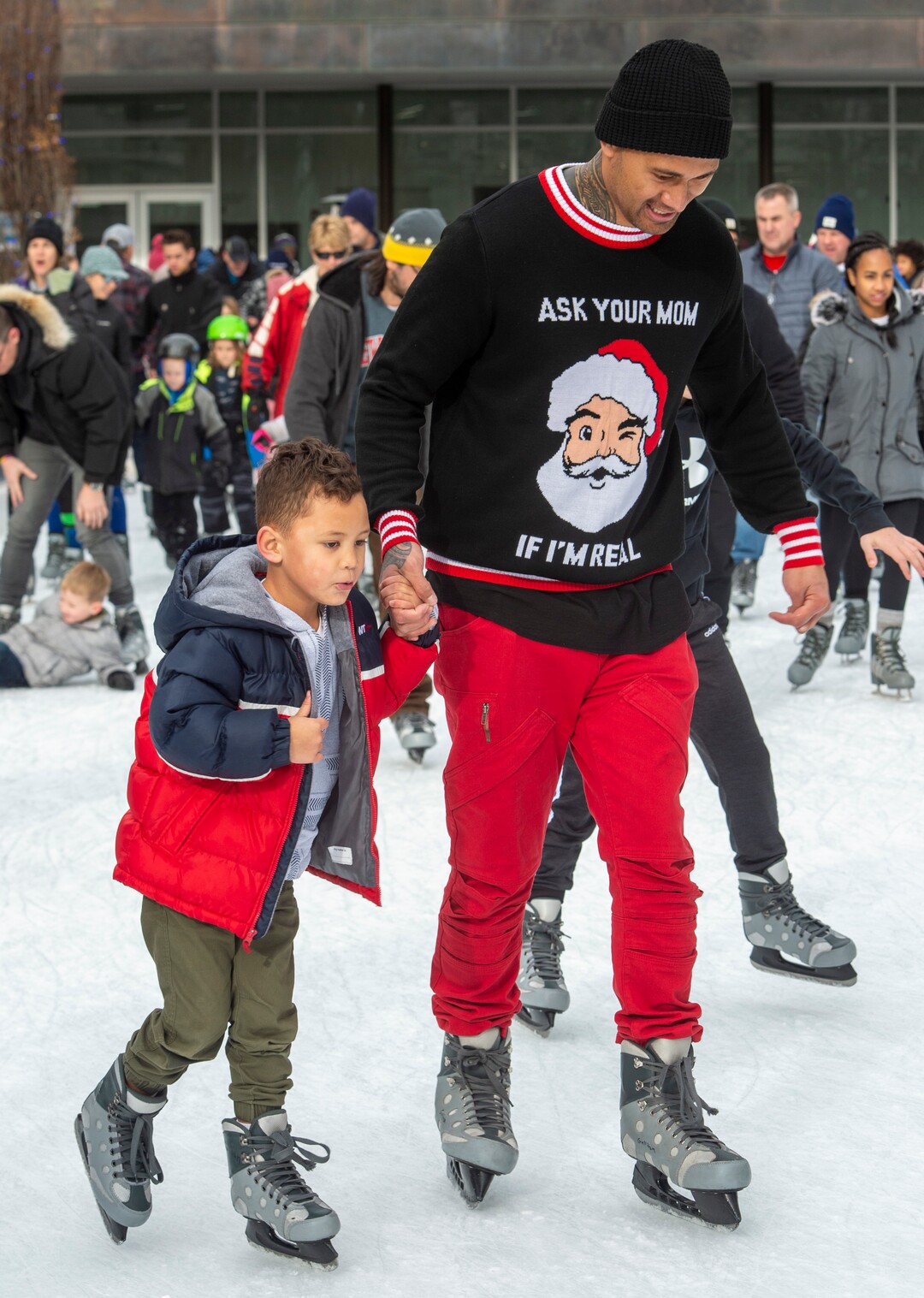 (Rick Egan  |  The Salt Lake Tribune) Make, 5, skates with his dad, Howard Tuisamoa, at the Gallivan Center on Christmas Eve, Tuesday, Dec. 24, 2019.