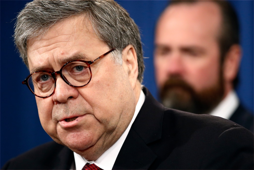 Attorney General William Barr speaks alongside Deputy Attorney General Rod Rosenstein about the release of a redacted version of special counsel Robert Mueller's report during a news conference, Thursday, April 18, 2019, at the Department of Justice in Washington. (AP Photo/Patrick Semansky)