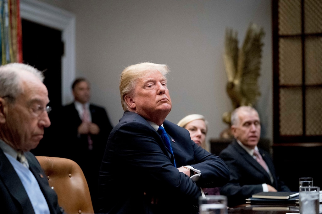 (AP Photo/Andrew Harnik) President Donald Trump, center, accompanied by Sen. Chuck Grassley, R-Iowa, left, Secretary of Homeland Security Kirstjen Nielsen, second from right, and Sen. Thom Tillis, R-N.C., right, listens during a meeting with Republican Senators on immigration in the Roosevelt Room at the White House, Thursday, Jan. 4, 2018, in Washington.