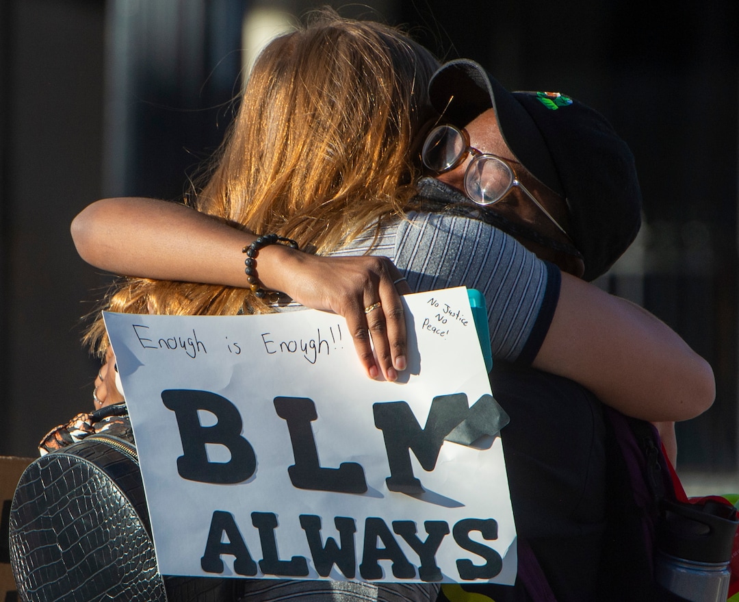 (Rick Egan  |  The Salt Lake Tribune)     Angela Johnson gets a hug from a friend during a demonstration in Salt Lake City, on Wednesday, June 10, 2020.