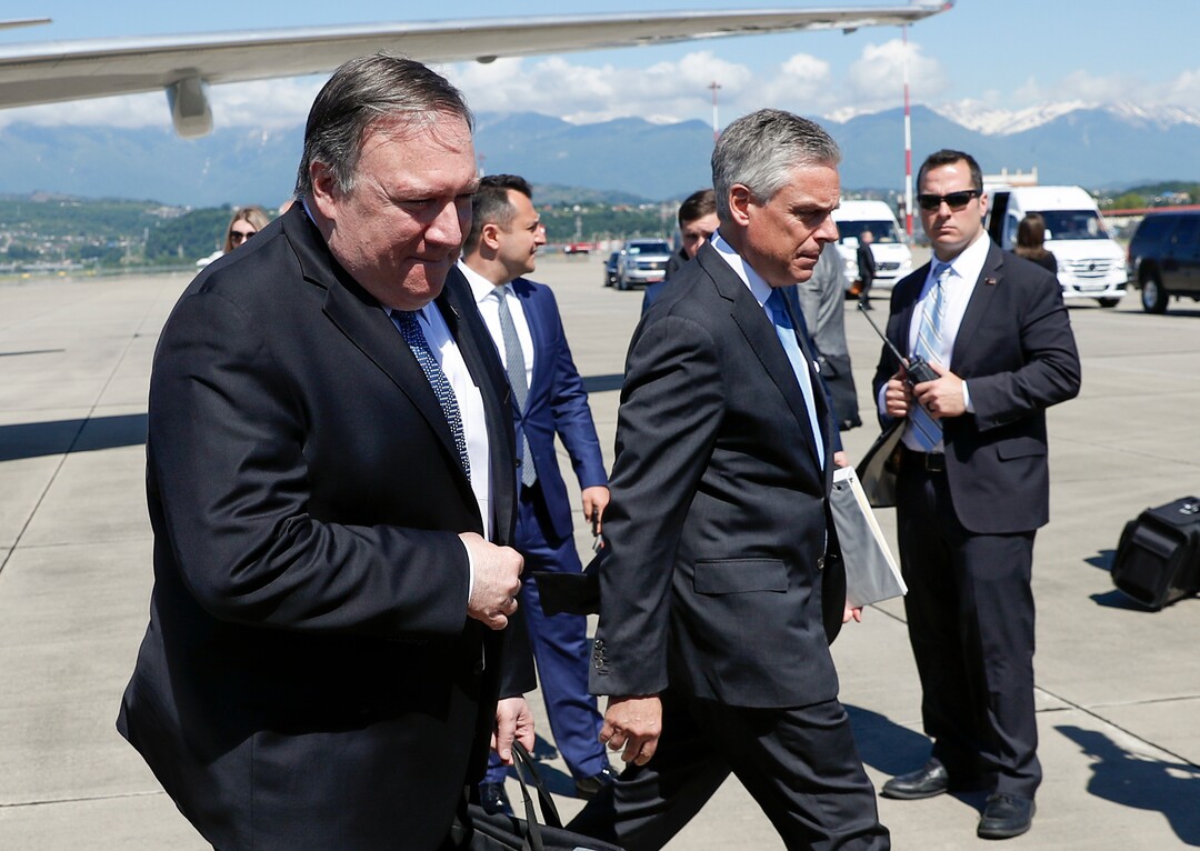 (Pavel Golovkin  |  AP Photo) U.S. Secretary of State Mike Pompeo, left, and U.S. Ambassador to Russia Jon Huntsman, foreground right, walk from the plane upon arrival at the airport in the Black Sea resort city of Sochi, southern Russia, Tuesday, May 14, 2019. Pompeo's first trip to Russia starts Tuesday in Sochi, where he and Russian Foreign Minister Sergey Lavrov are sitting down for talks and then having a joint meeting with President Vladimir Putin. 
