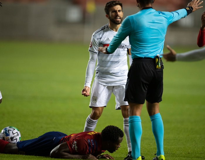 (Rick Egan  |  The Salt Lake Tribune). Real Salt Lake defender Nedum Onuoha (14) lies on the ground as Los Angeles FC forward Diego Rossi (9) complains to the official, in MLS soccer action between Real Salt Lake and Los Angeles FC at Rio Tinto Stadium, on Wednesday, Sept. 9, 2020.


