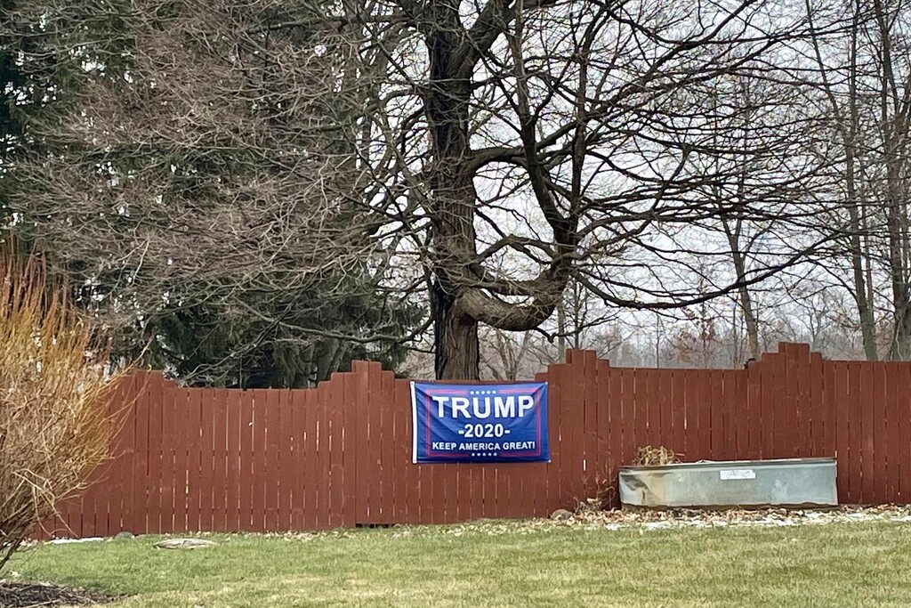 (AP Photo/Farnoush Amiri)
This photo made on Jan. 25, 2021 shows one of the Trump 2020 flags and insignia that are displayed on lawns and property in the village of Woodstock, Ohio. The village with less than 300 people was recently the scene of the arrest of two of its residents for what the FBI calls their plot and participation in the deadly U.S. Capitol breach on Jan. 6.