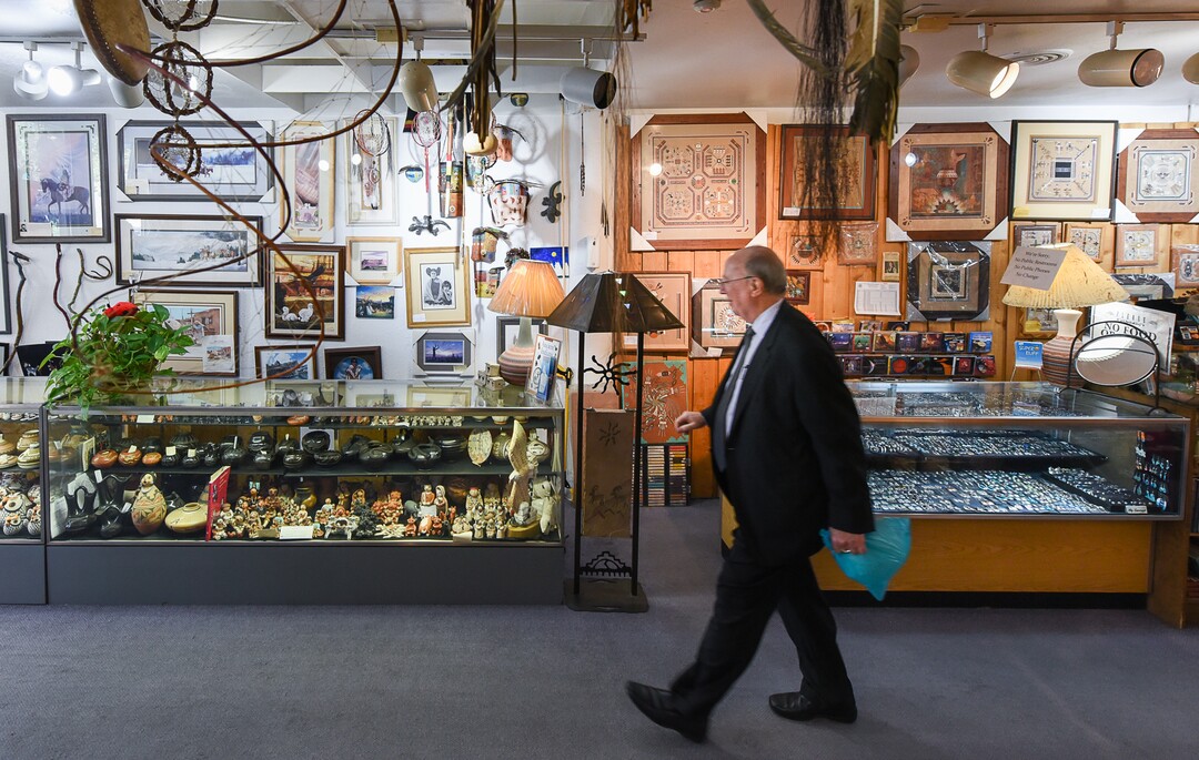 (Francisco Kjolseth  |  The Salt Lake Tribune)  George Sutton, a long time patron of TP Gallery, an institution on Main Street for over 44 years, known for some of the most authentic Native American art around the city, finds a unique gift for a colleague who is retiring during a recent visit to the store which is scheduled to close before the end of the year.