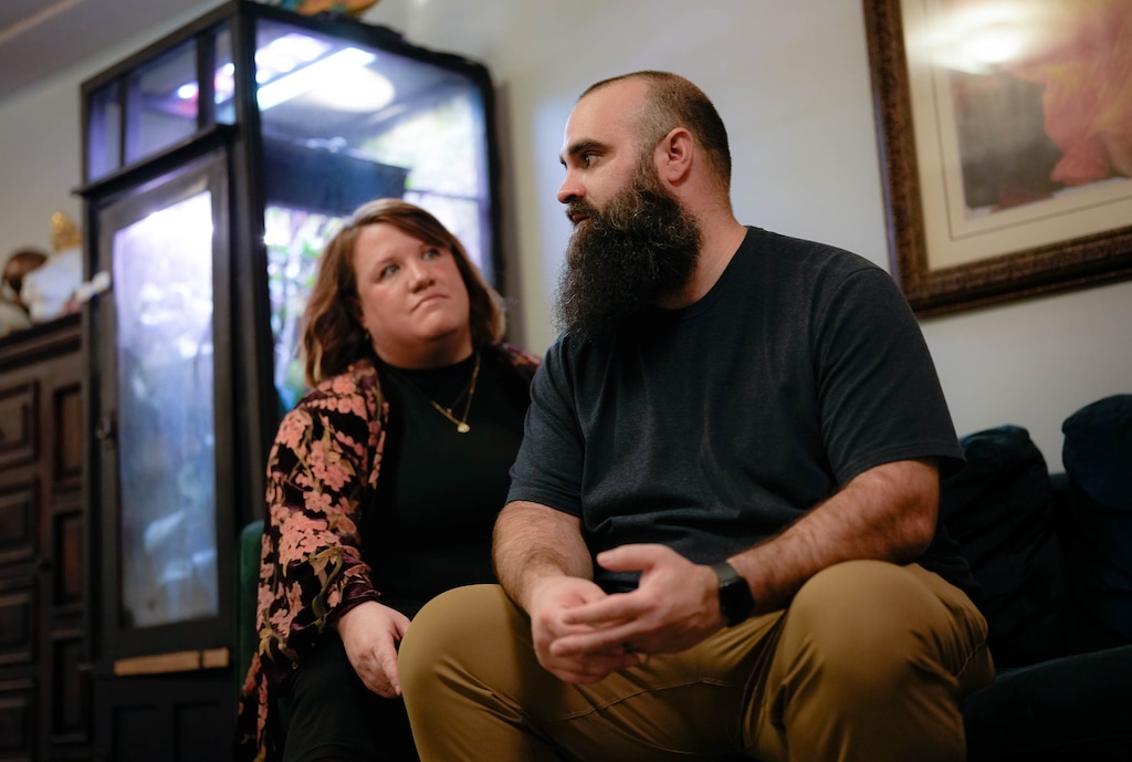 (Francisco Kjolseth  | The Salt Lake Tribune) Axel Anderson is joined by his wife, Alicia, at their home in Holladay, on Nov. 4, 2024, as he recalls memories of his dad, Steven Anderson, who disappeared 20 years ago. About a month earlier, investigators found Steven Anderson's car underwater at Starvation Reservoir.